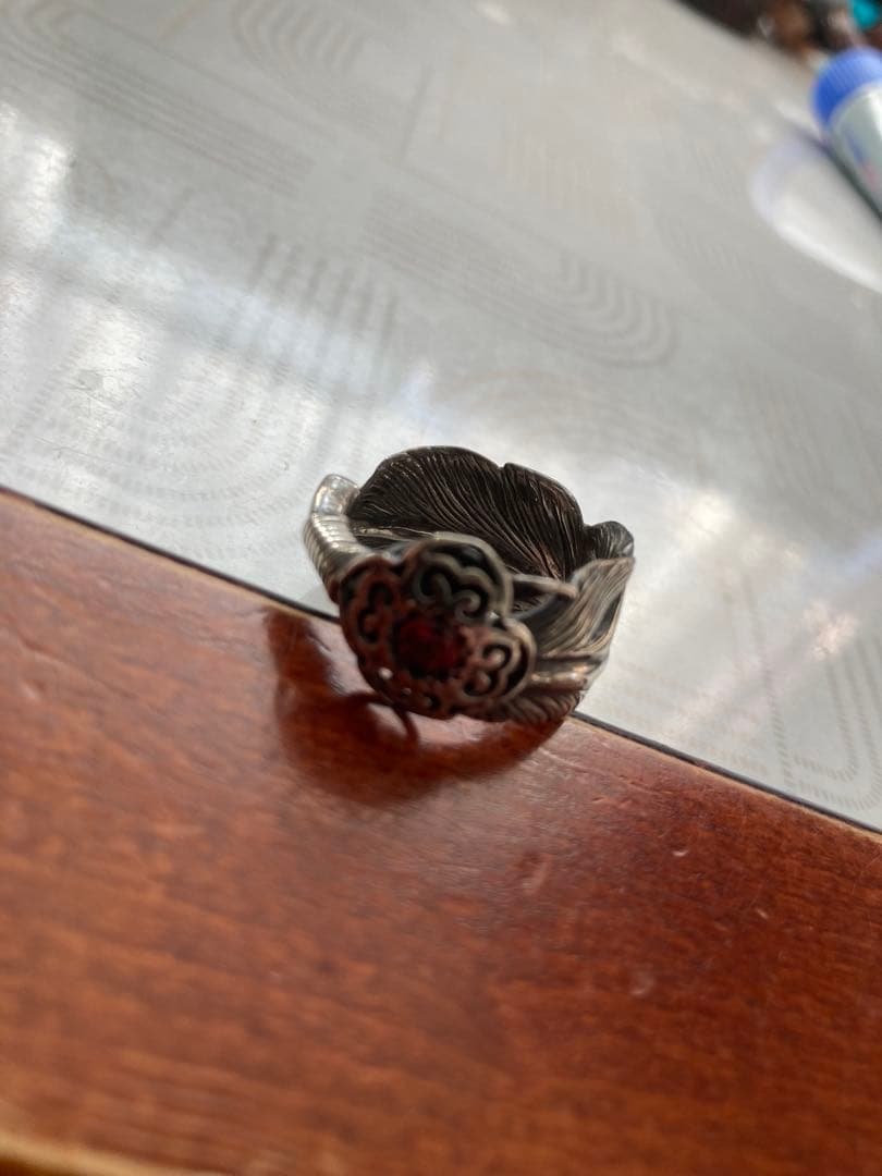 DESIGNERS JEWELRY buff フェザーリング エンブレム付